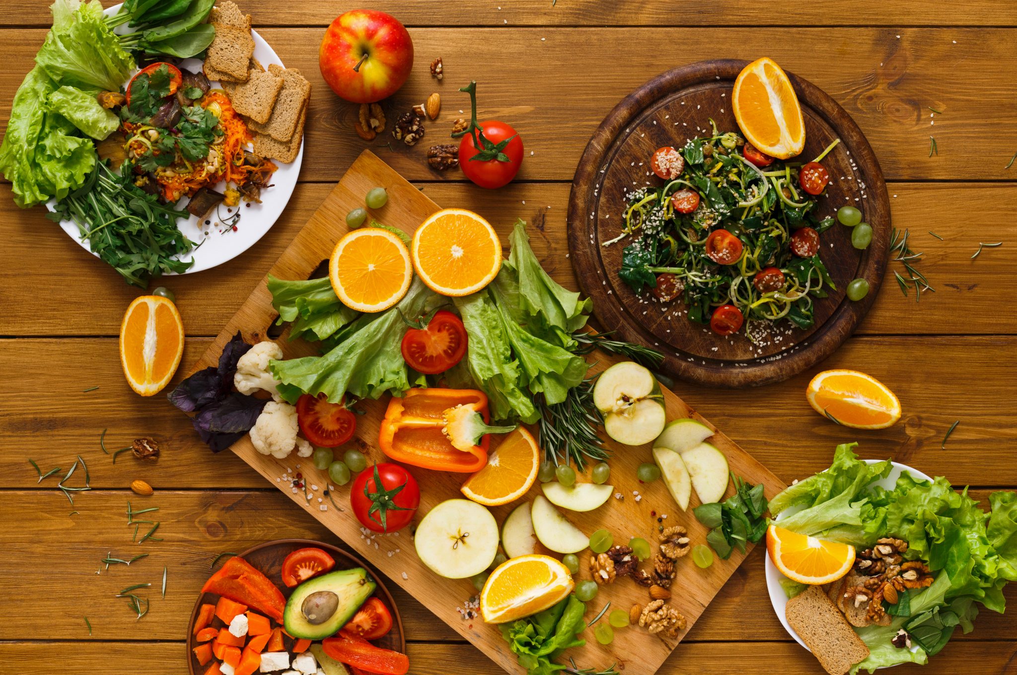 wooden-table-served-with-cut-fruits-and-vegetables-2023-11-27-05-36-17-utc-2048x1360.jpg